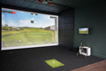 Custom faux leather acoustic wall and ceiling panels in a golf simulator bay